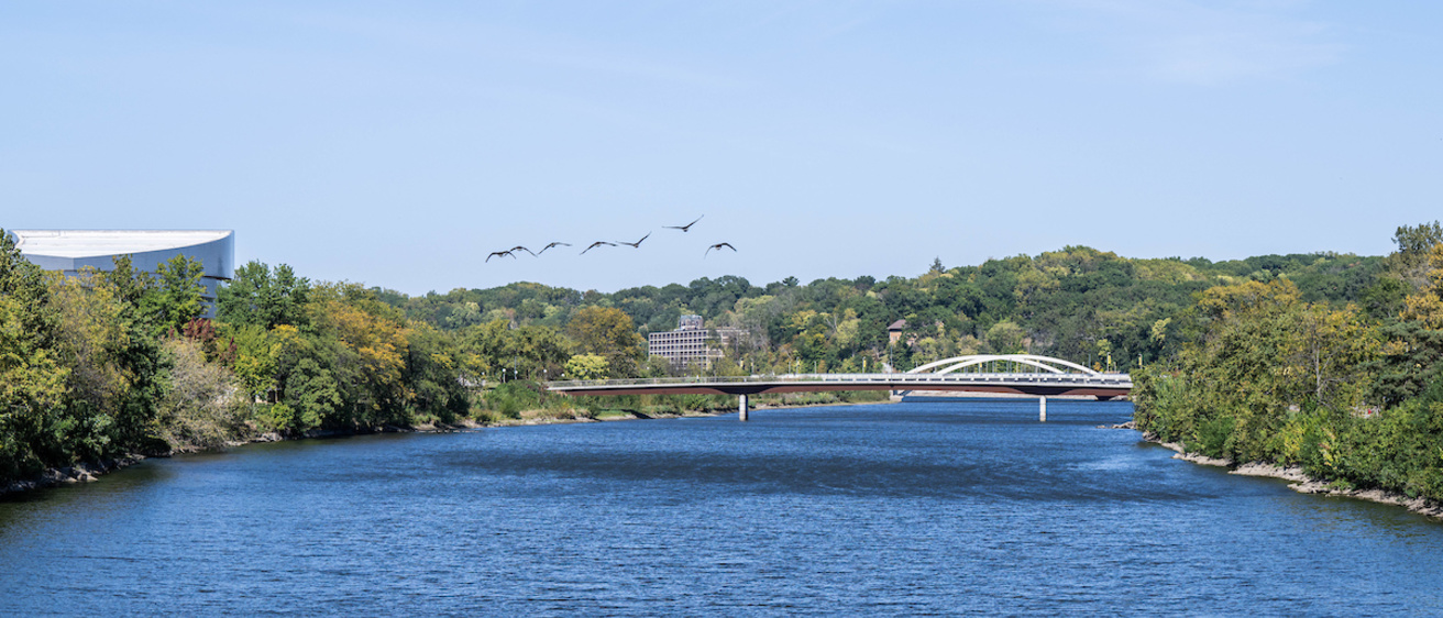 A pedestrian bridge over a river